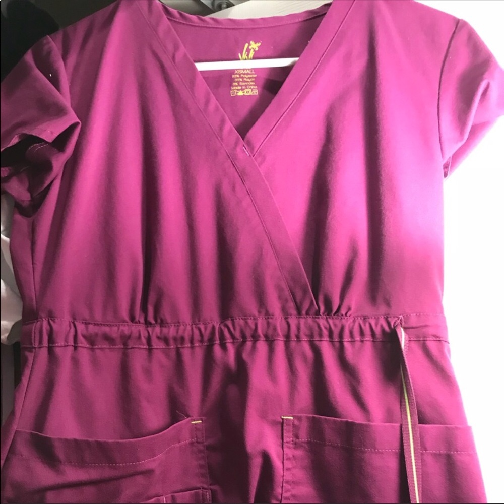 2 pairs of nursing scrubs